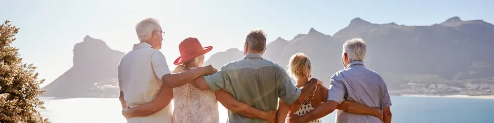 Group of senior travelers admiring a scenic view
